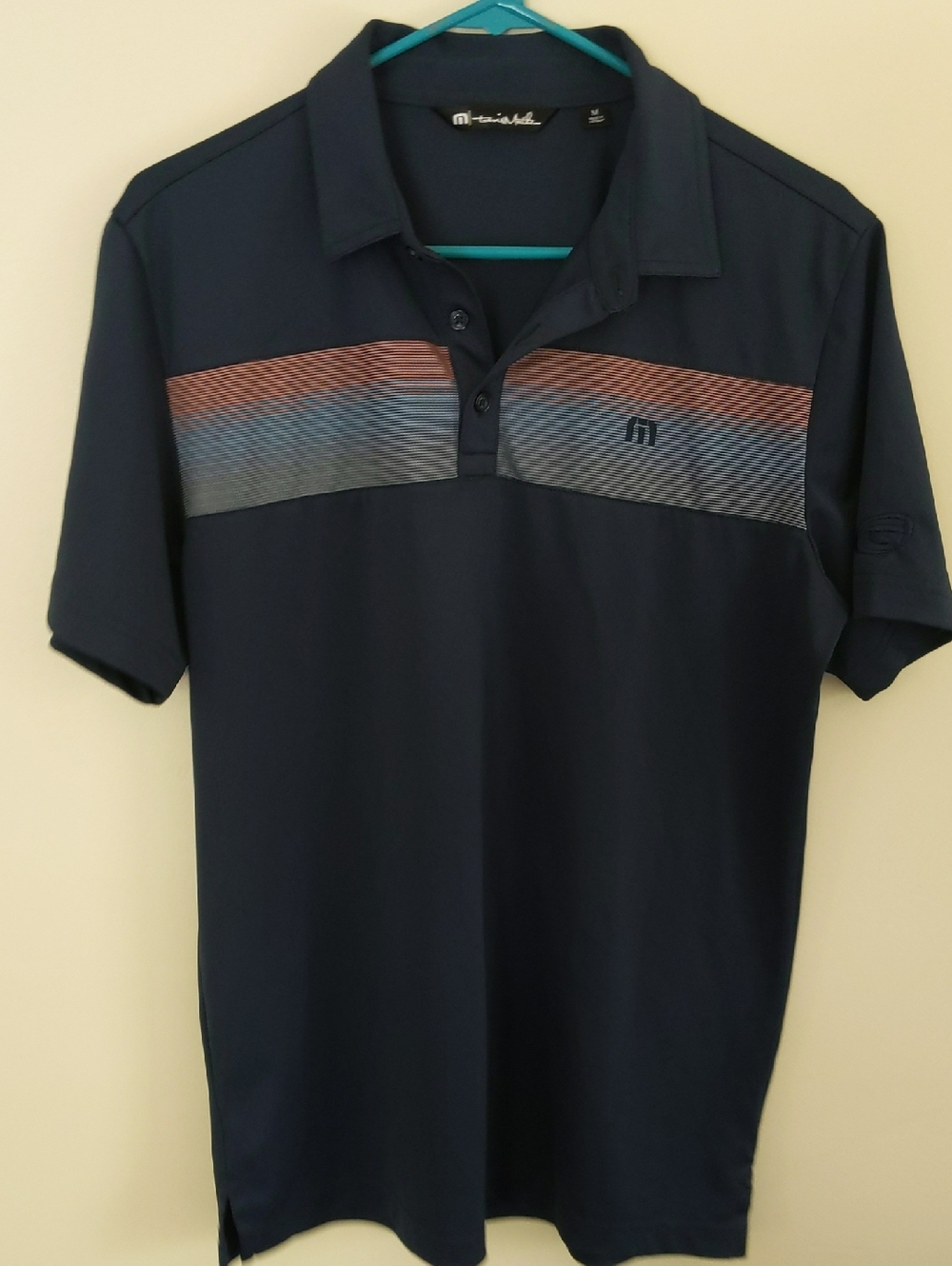 Travis Matthew Navy Polo with Multicolor Striped Chest
